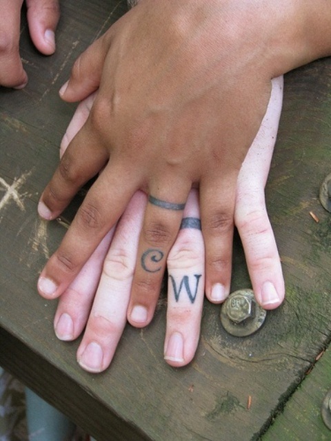 Wedding band tattoos with each other initials is timeless classics to rock