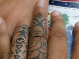 Unique couples tattoos in tribal style covering the whole finger