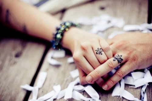 If there are any symbols or images for your couple, tattoo them on your fingers, so that only you two could know the meaning