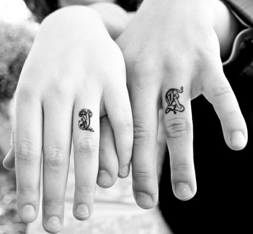 Ring finger initials done with a creative and bold printing type