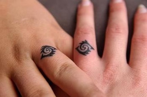 Tribal married couple matching tattoos look very original and unusual