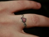Girls can try romantic and cute heart tattoos in color with with pretty detailing