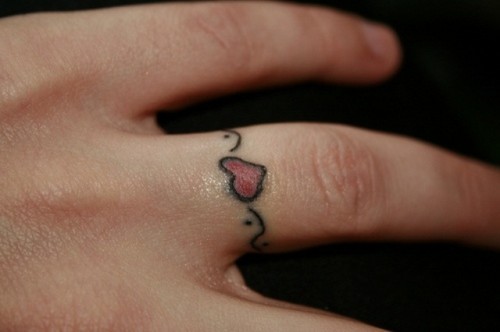 Girls can try romantic and cute heart tattoos in color with with pretty detailing