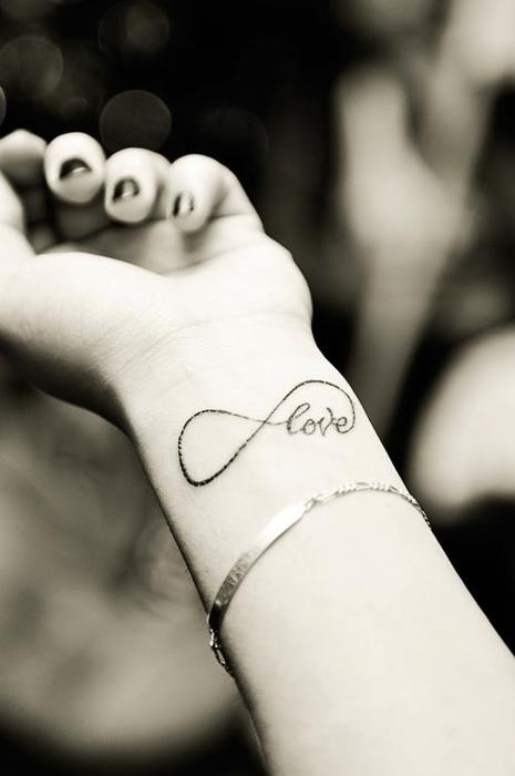 love and an infinity sign on your wrist are a lovely idea for any wedding, such a stylish tattoo will be always great