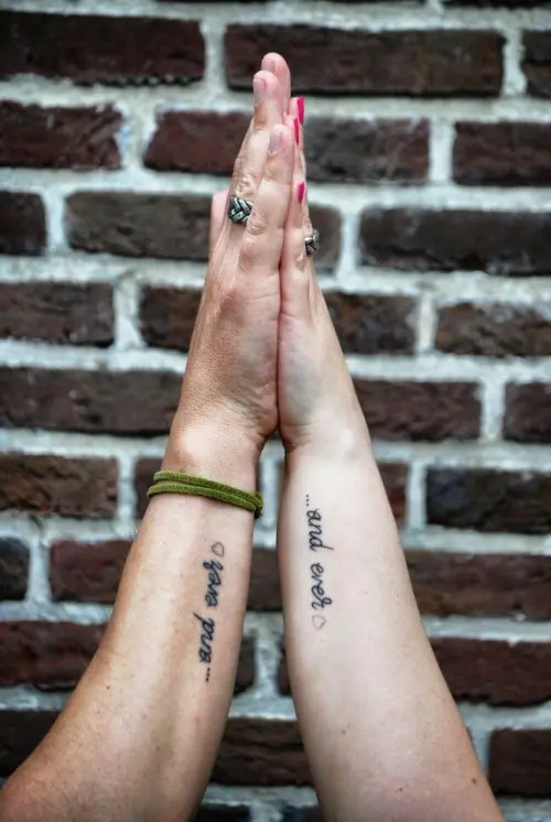 'and ever' tattoos on the side of the arm is a cool idea to show off how important and long-lasting your relationship is