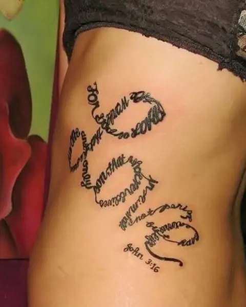a side tattoo with the word 'Love' that consists of a quote from the Bible is a very bold and catchy idea