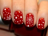 red winter wedding nails with white polka dots and snowflakes are gorgeous for a snow-loving bride
