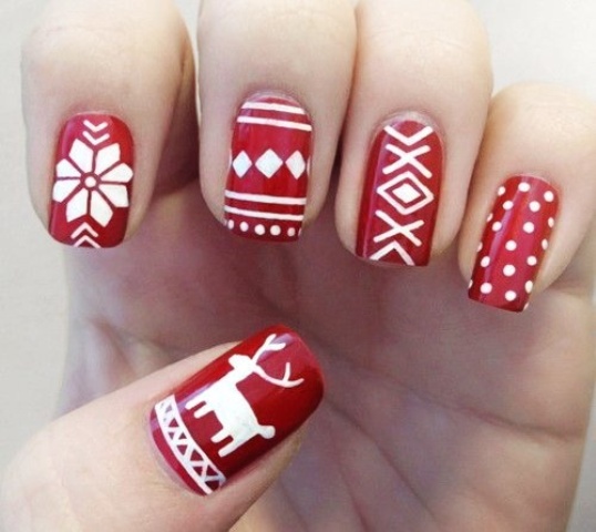 a red manicure with white patterns   Scandinavian winter ones for a cozy and cool winter look