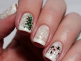 a French manicure with glitter, polka dots, trees and snowmen is a stylish and whimsical idea to rock