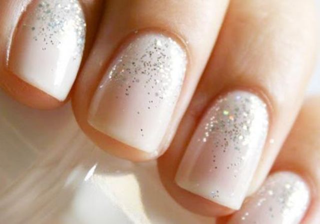a blush wedding manicure with a bit of silver glitter on top is a stylish glam idea to rock