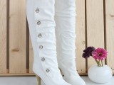 white tall boots with rhinestone buttons and heels will be a whimsy and cool option for a winter bride