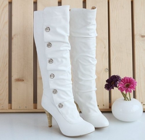 white tall boots with rhinestone buttons and heels will be a whimsy and cool option for a winter bride