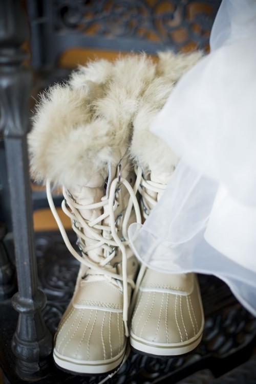 tall fur boots with laces are amazing for a snowy wedding, just change them for usual shoes inside