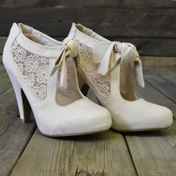 neutral cutout booties with lace inserts and ties are great for vintage inspired winter brides