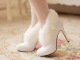 white heeled fur booties are a chic and cute shoe idea for a winter bride, you’ll feel a snowy queen