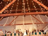 string lights and candles are a gorgeous combo for a wedding venue, candles will add a strogn romantic feel to it
