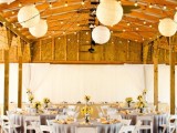 string lights and paper pendant lamps are a great combo for a wedding venue, they can be a nice and bold decor idea for a space