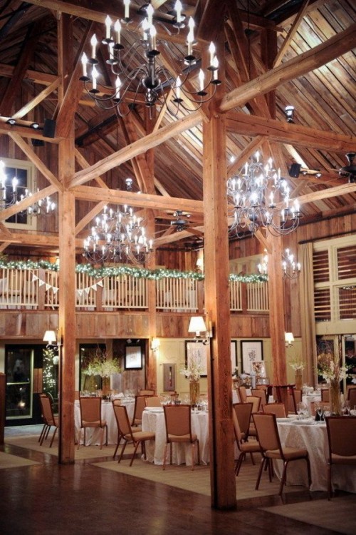 vintage chandeliers and string lights are always a good idea for a barn wedding, whatever the season and the theme of the wedding is