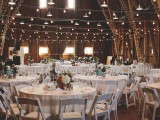 cover pillars and wooden beams with string lights to make your wedding venue shine in a creative way and to highlight the architecture of the space