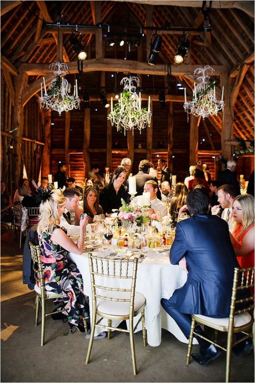 crystal chandeliers with greenery are a great type of decor and source of light, add candles to the tables