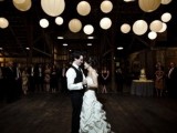 a barn venue lit up with lots of paper pendant lamps is a gorgeous idea that won’t break the bank and will keep your budget up