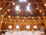 string lights covering the pillars, hanging over the venue and retro pendant lamps are gerat for illuminating a wedding venue