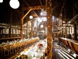 lights covering pillars and paper pendant lamps are a nice pair for a barn wedding venue