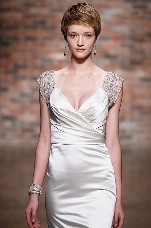 a silk V-neckline draped wedding dress with fully embellished shoulders is a very sophisticated and chic idea to rock