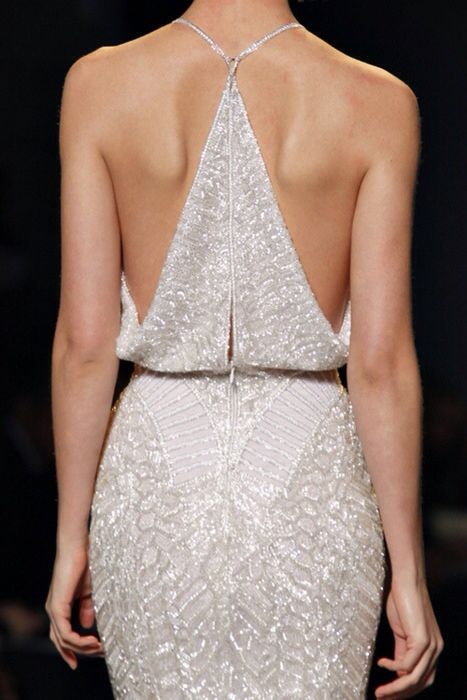 an ultra-modern fully beaded wedding dress with patterns and a racer back is a bold and sexy idea for a wedding