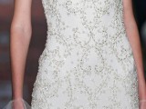 a refined beaded wedding dress wiht a faux sweetheart neckline, with beautiful floral patterns and a clear top is chic