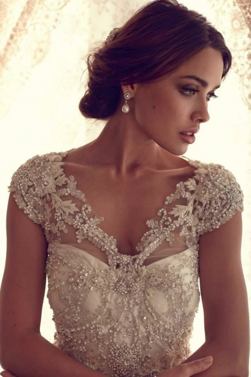a fully beaded and chic wedding dress with a V-neckline and a strapless underdress is a chic and bold idea