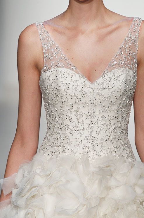 an A-line beaded wedding dress, with a faux sweetheart neckline and a ruffle skirt is a gorgeous idea for a wedding