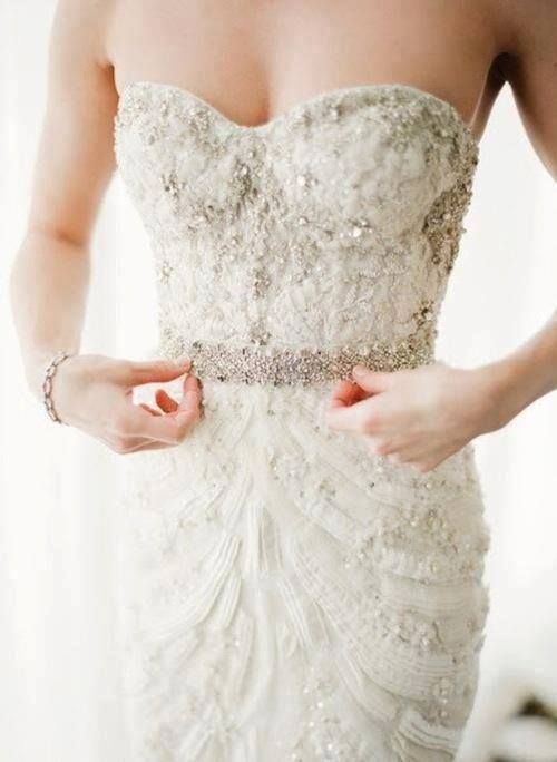 a sophisticated fitting strapless lace applique wedding dress with beads and a beaded sash is a gorgeous idea for a wedding