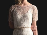 a plain slip underdress paired with a gorgeous sheer lace beaded overdress with a high neckline and short sleeves plus an embellished belt