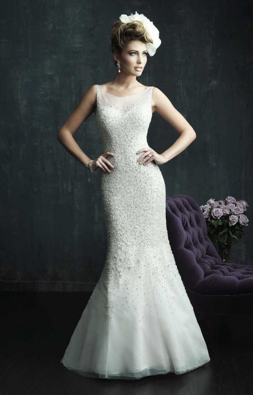 a sleeveless mermaid beaded wedding dress with a faux sweetheart neckline is a lovely idea for a glam bride
