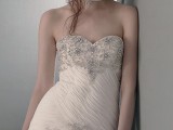 a refined sweetheart neckline strapless beaded wedding dress with a matching headband for a fashion-forward bride