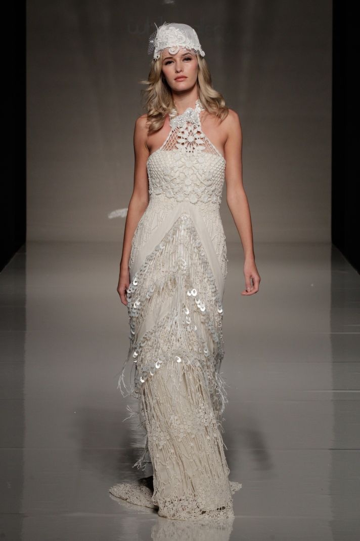 A boho lace embellished fitting wedding dress with a halter neckline and matching headpiece