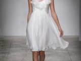 a romantic and flowy knee wedding dress with a ruffle neckline, no sleeves looks retro and will be comfy to wear at the beach