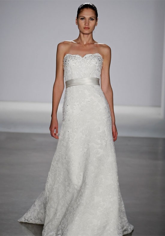 A strapless lace embellished wedding dress with a silver silk sash is a very romantic and chic idea