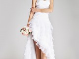 a strapless high low wedding dress with an asymmetrical ruffle skirt with a train for a romantic bride
