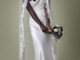 a minimalist silk sheath wedding dress and a long veil with a lace trim for a modern beach bride