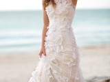 a romantic mermaid wedding gown with an illusion halter neckline and lace appliques is chic