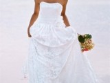 a vintage strapless wedding dress with a lace skirt is a timeless option that looks elegant and refined