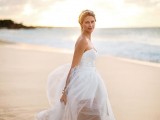 a chic strapless wedding gown with a sweetheart neckline and an illusion skirt plus a headpiece is a beautiful idea