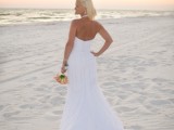 a strapless mermaid wedding gown with a statement necklace is a timeless idea for a beach bride