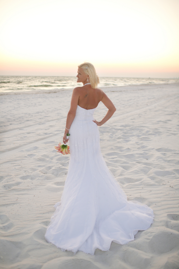 A strapless mermaid wedding gown with a statement necklace is a timeless idea for a beach bride