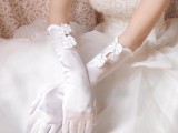 a modern take on classic vintage long gloves with cutouts and bows are great for a vintage or just refined bridal look