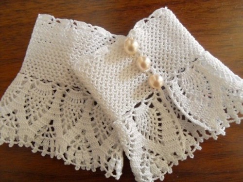 white crochet fingerless gloves with white pearl buttons are amazing for a boho or vintage bridal look, for any season when it's chilly