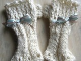 long white knit fingerless gloves with blue bows are great for a winter bride, they will keep you comfy while shooting outside