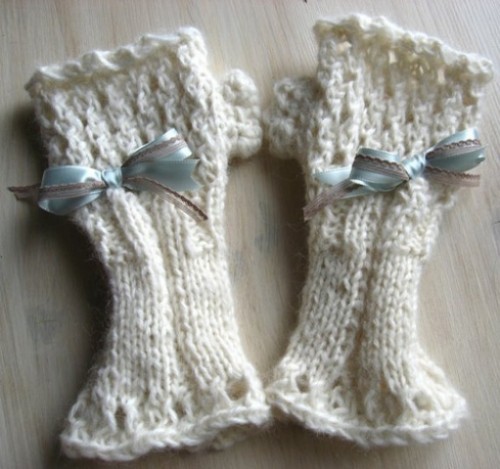 long white knit fingerless gloves with blue bows are great for a winter bride, they will keep you comfy while shooting outside